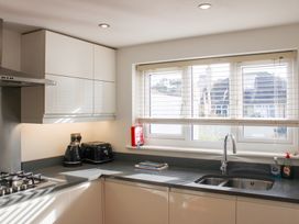 A kitchen with a sink and countertop at the Old Police House in Salcombe