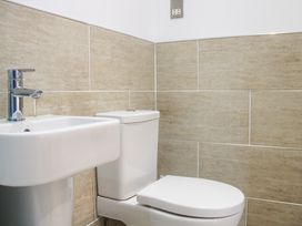 A bathroom with a sink and toilet at Old Police House in Salcombe