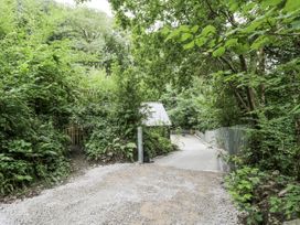 An outdoor area with a path and gate at Frongoch Old Power House in Dolgellau