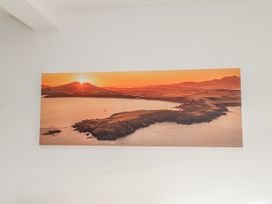 A landscape photograph of a coastline at sunrise at Morannedd in Morfa Nefyn