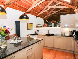 A kitchen with a sink and appliances at Halshanger Barn Newton Abbot
