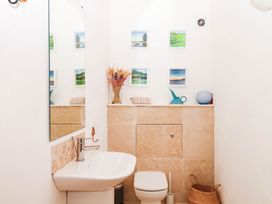 A bathroom with a sink and toilet at Halshanger Barn in Newton Abbot