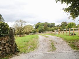 A gravel path leading through greenery at Halshanger Barn in Newton Abbot