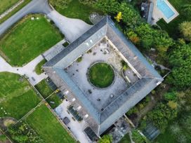 An aerial view of a property with a garden and pool at Halshanger Barn near Ashburton