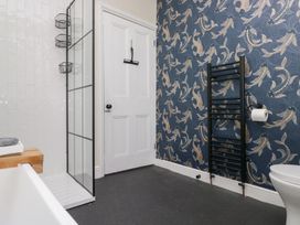 A bathroom with a shower and toilet at The Wonky Nest in Bowness-On-Windermere