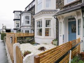 A front yard with a fence and a door at The Wonky Nest in Bowness-On-Windermere