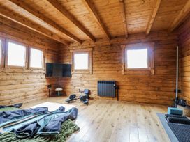 A gym with wooden walls and windows at Bee Hive in South Luffenham near Edith Weston