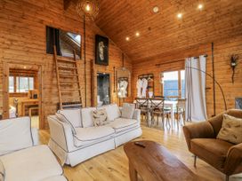 A living room with a sofa and dining table at Rabbit Hole near Stamford