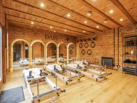 An exercise studio with reformer Pilates machines at Rabbit Hole near Stamford