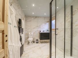 A bathroom with a shower and toilet at Rabbit Hole near Stamford