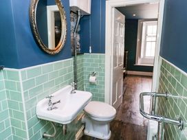 A bathroom with sink and toilet at Unicorn Cottage in 