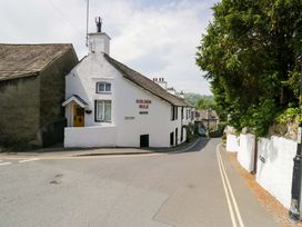 A house with a sign at Golden Rule in an outdoor location