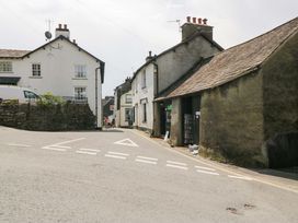 A street with houses and a road in Unicorn Cottage