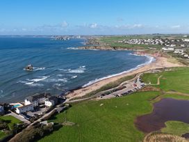 An aerial view of a beach and cars parked near Sea View Beach Apartment Thurlestone