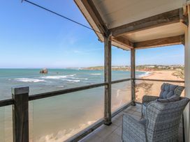 A balcony view of the ocean and beach at Seaview Beach Apartment, 11 Thurlestone Rock in Thurlestone