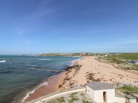 A view of the beach and sea at Seaview Beach Apartment, 11 Thurlestone Rock in Thurlestone
