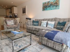 A living room with a sofa and armchair at The Trick in Carbis Bay