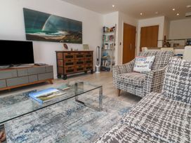 A living room with a coffee table and a television at The Trick in Carbis Bay