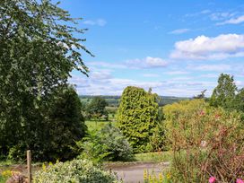 A view with trees and greenery at The Old Barn in Pentre Celyn