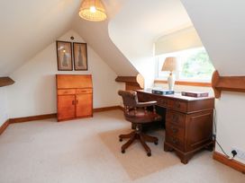 An office with a desk and chair at The Old Barn in Pentre Celyn