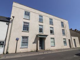 A building with multiple windows and a door at Cliff View in Seaton