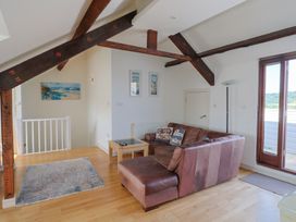 A living room with a sofa and coffee table at Cliff View in Seaton