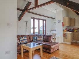 A living room with a sofa and a coffee table at Cliff View in Seaton