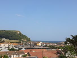 A view of buildings and the ocean at Cliff View in Seaton