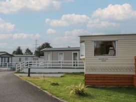 Caravans along a pathway at Yew in Denny