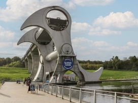 A canal with a sign at the Falkirk Wheel in Denny