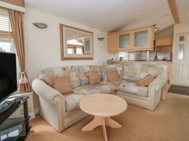 A living room with a sofa and coffee table at Birch in Denny