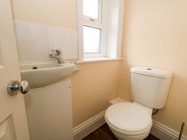 A bathroom with a sink and a toilet at Garden Retreat in Swanage