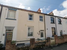 A row of houses with windows and a door at Number 33 in Scarborough