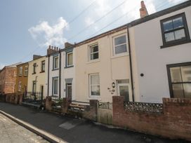 A row of houses with a fence in Number 33 Scarborough