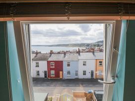 A view from a window showing houses and the sea at Number 33 in Scarborough