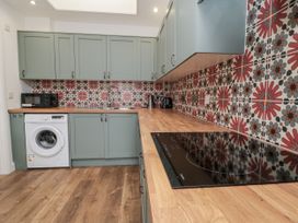A kitchen with cabinets and appliances at Number 33 in Scarborough