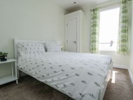 A bedroom with a bed and a window at Number 33 Scarborough