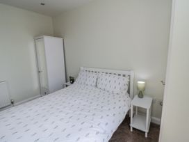 A bedroom with a bed and bedside table at Number 33 in Scarborough