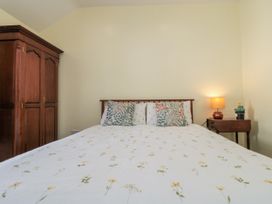 A bedroom with a bed and nightstand at Number 33 in Scarborough