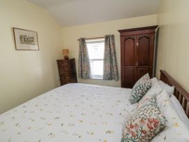 A bedroom with a bed and furniture at Number 33 Scarborough