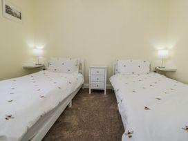 A bedroom with two single beds at Number 33 in Scarborough