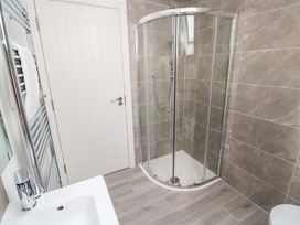 A bathroom with a shower and sink at Miramar, St. Ives