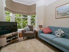A living room with a sofa and television at 28 Rock Villas in Carnforth