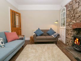 A living room with a sofa and fireplace at 28 Rock Villas in Carnforth