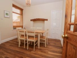 A dining room with a table and chairs at 28 Rock Villas Carnforth