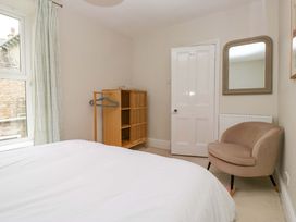 A bedroom with a bed and wardrobe at 28 Rock Villas Carnforth