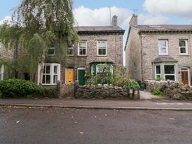 Two stone houses with gardens in front at 28 Rock Villas Carnforth