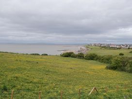 A coastal view with sea and grassland at 28 Rock Villas in Carnforth