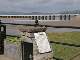 A pier with an information plaque and water view at 28 Rock Villas in Carnforth