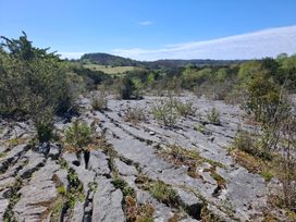 A rocky landscape with shrubs and hills at 28 Rock Villas Silverdale